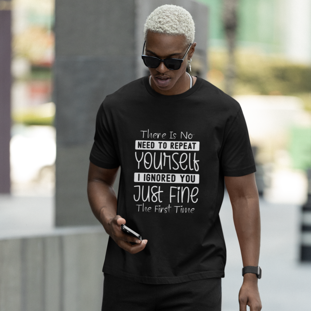 Man Walking Looking at Cell Phone Wearing A Crew Neck T-Shirt with Text - "There Is No Need to Repeat Yourself. I Ignored You Just Fine the First Time" - Heather Black