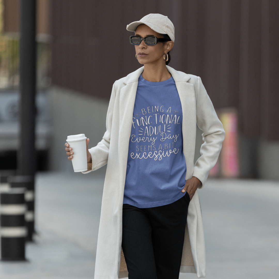 A Woman Wearing a White Trench Coat Holding Coffee Wearing a Crew Neck T-Shirt with Text - &quot;Being a Functional Adult Every Day Seems a Bit Excessive&quot; - True Royal Heather Blue