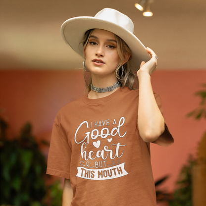 A Woman With a White Hat Wearing A Crew Neck T-Shirt with Text - &quot;I Have a Good Heart, But This Mouth&quot; - Toast